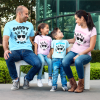 couple-with-kids-wearing-different-tees-mockup-sitting-on-a-bench-while-outdoors-a15484